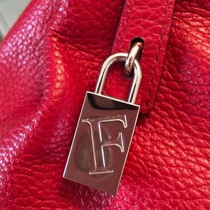 Furla cherry-red leather handbag.